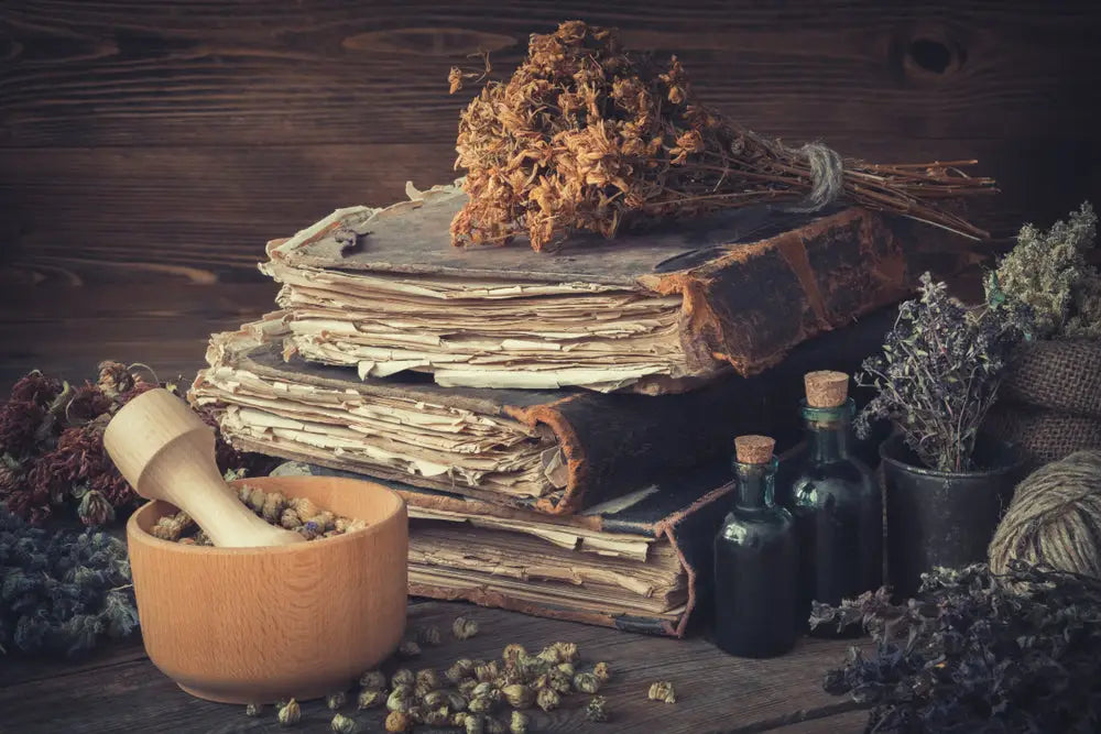 Apothecary soy candle with an open book.