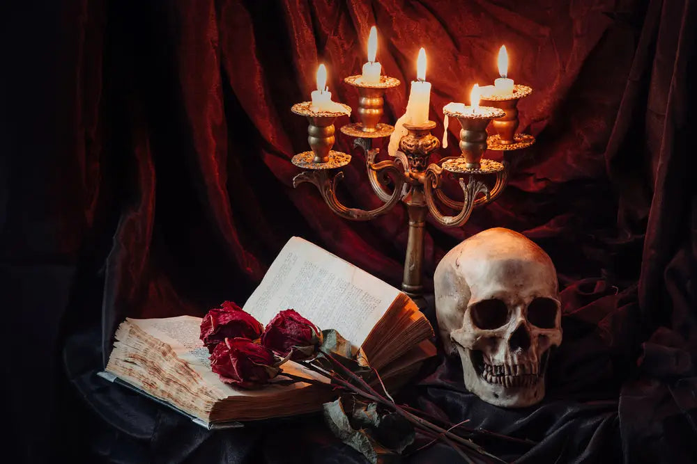 Classic horror soy candle with pumpkins and a leather bound book.