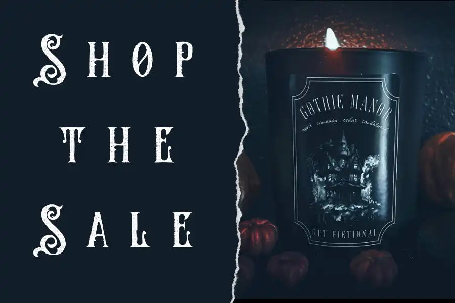 A black candle with a decorative label.