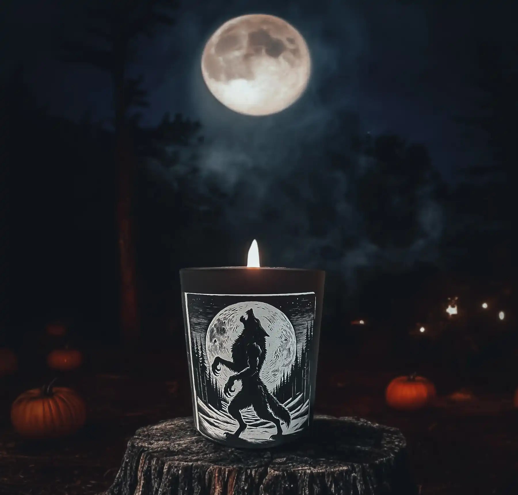 A lit candle in a dark glass jar featuring a howling werewolf silhouette against a full moon.