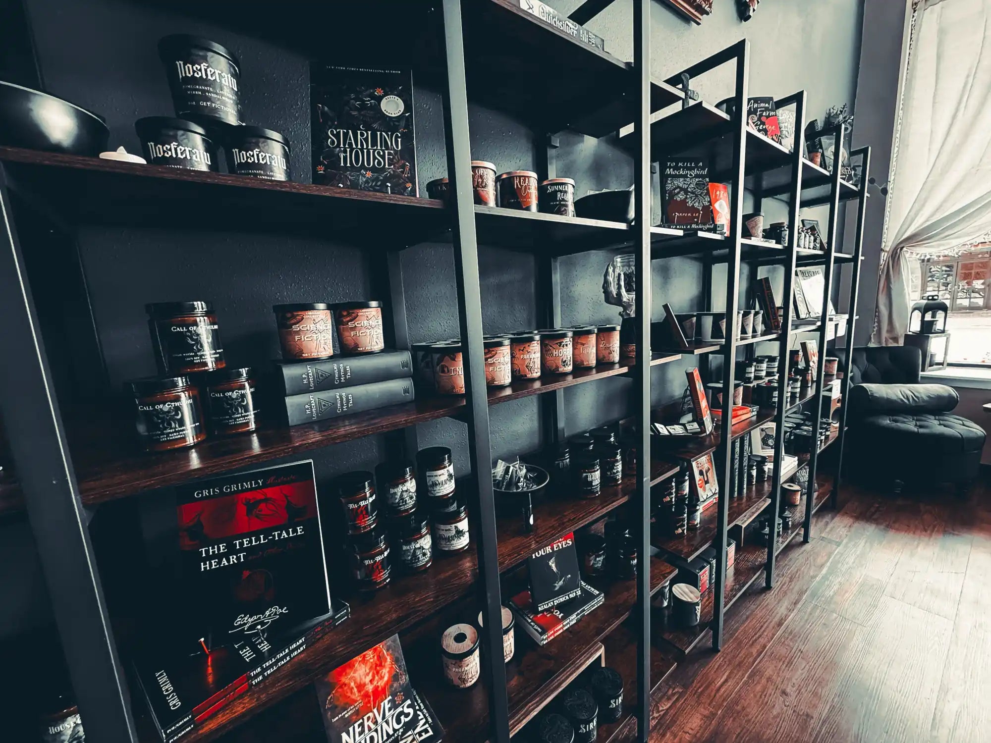 A multi-level metal and wood shelving unit filled with various jars, books, and decorative items.